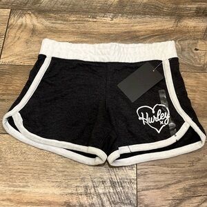 Girls pull on Hurley shorts